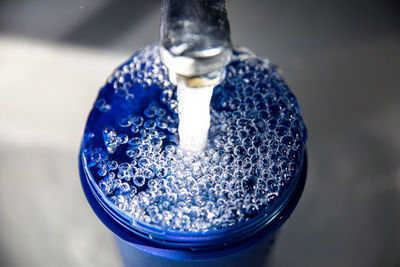 High angle view of drink in glass container on table