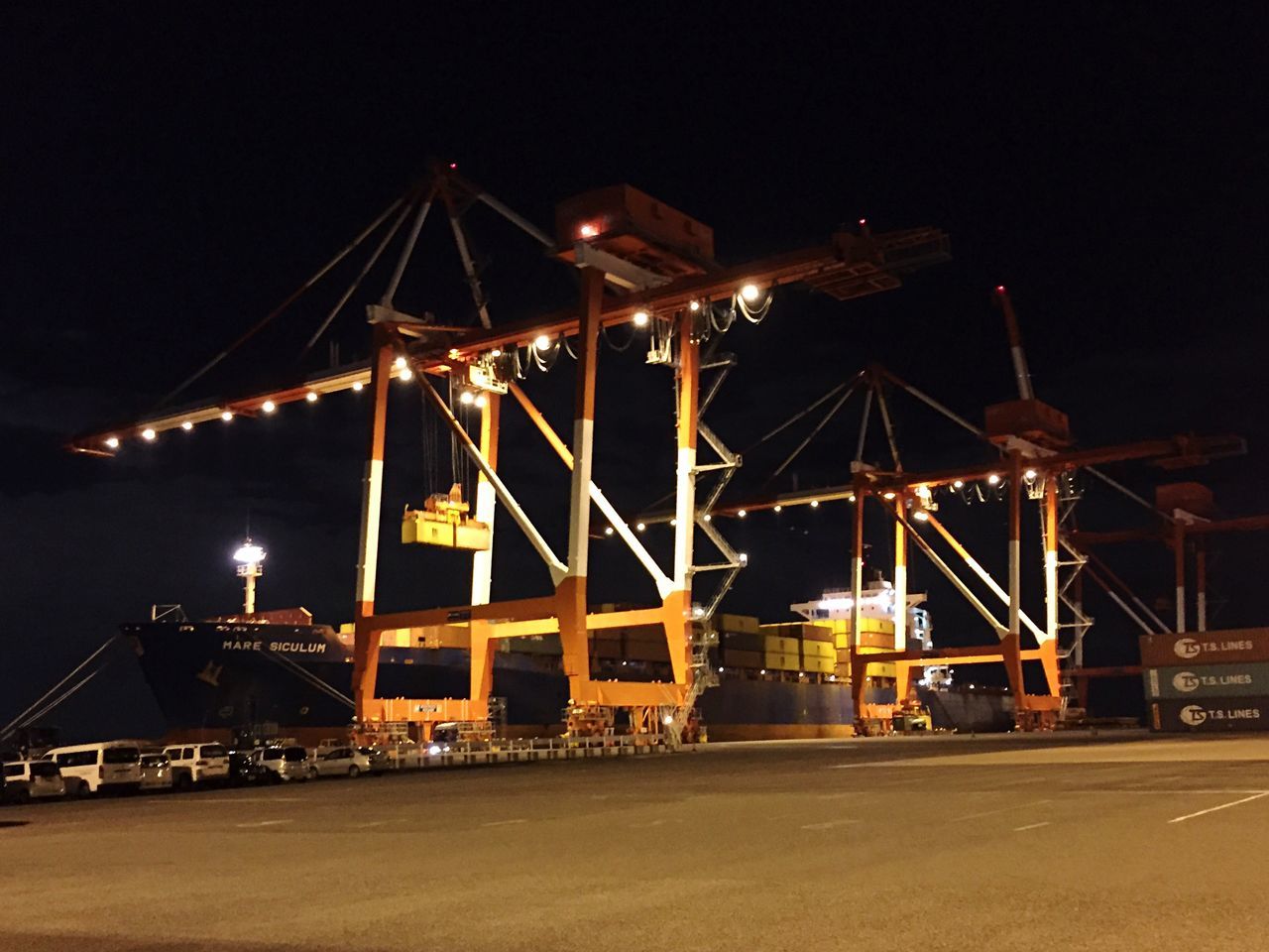 night, illuminated, built structure, transportation, architecture, sky, street light, building exterior, lighting equipment, outdoors, crane - construction machinery, clear sky, river, no people, copy space, industry, city, street, bridge - man made structure, connection