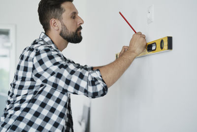 Man working on wall