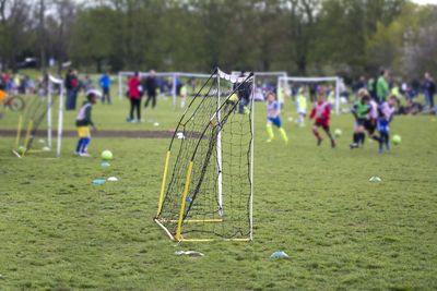 People playing soccer on field