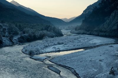 Scenic view of mountains against sky during winter