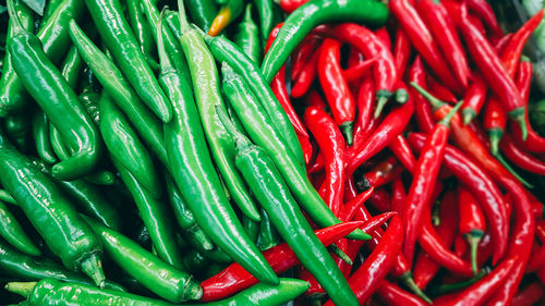 Full frame shot of red chili peppers for sale in market