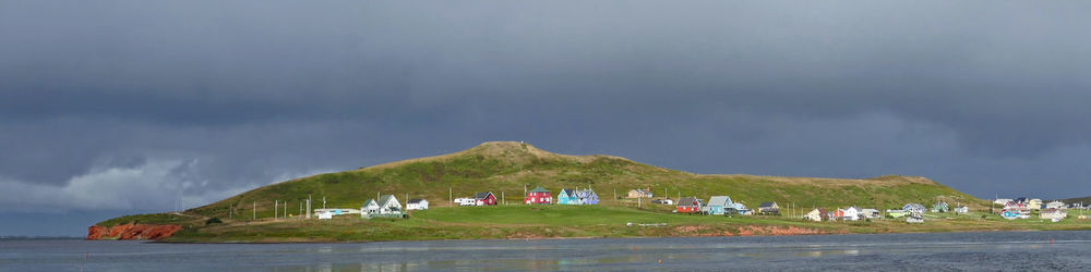 Panoramic view of building against cloudy sky