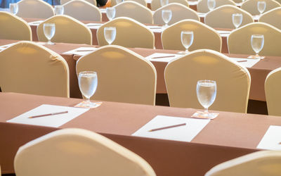 Full frame shot of empty chairs and table at seminar