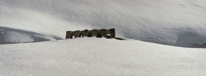 Wooden structure buried in snow