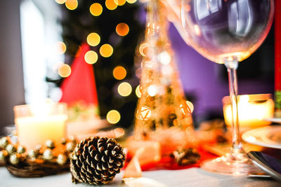 Close-up of illuminated candles on table