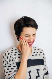 Young woman against white background