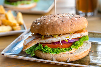 Close-up of hamburger in plate on table