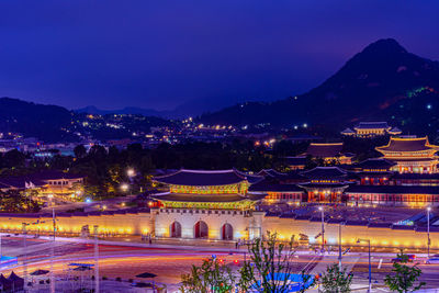 High angle view of illuminated buildings at night