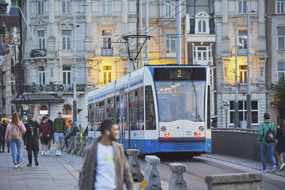 People walking on street in city