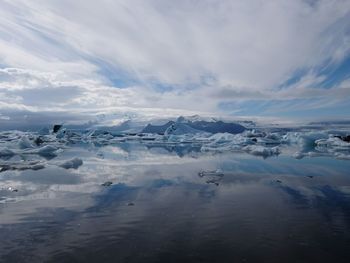 Scenic view of frozen lake against sky