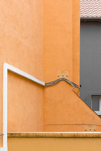 Low angle view of orange wall