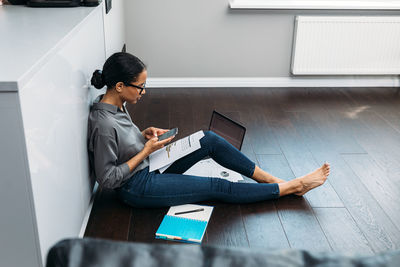 High angle view of woman working at home