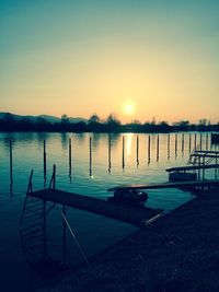 Scenic view of lake against sky during sunset