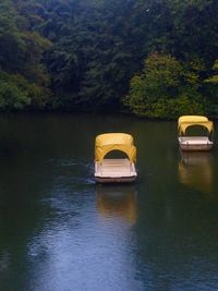 Boats in calm lake