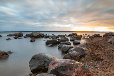 Scenic view of sea against sky at sunset