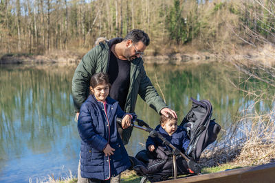 Portrait of senior man working on lake
