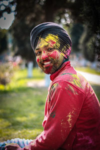 Portrait of smiling young man outdoors