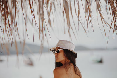 Woman wearing sunglasses at beach