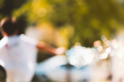 Rear view of people standing outdoors