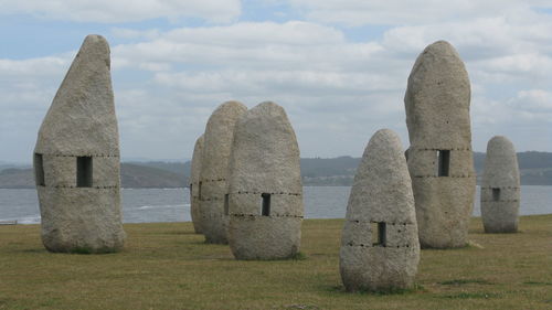 Rocks against cloudy sky