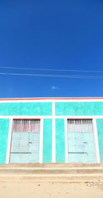 Low angle view of building against blue sky