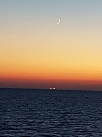 Scenic view of sea against sky at sunset