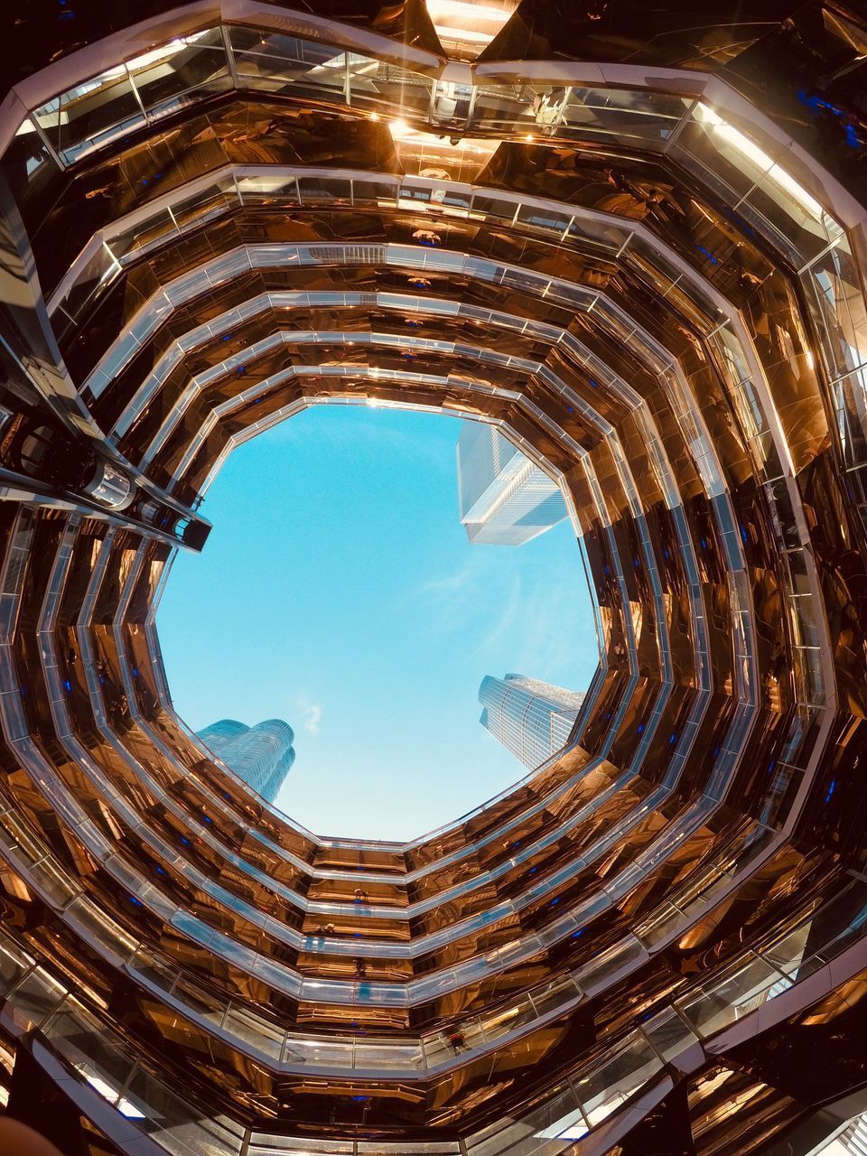 LOW ANGLE VIEW OF SPIRAL STAIRCASE IN BUILDING