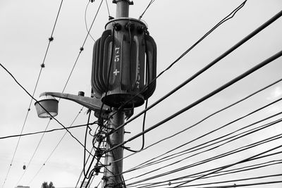 Low angle view of street light against sky