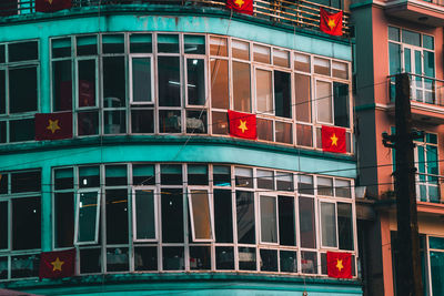 Low angle view of building with flag