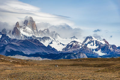 Scenic view of snowcapped mountains against sky