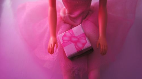 Low section of woman with pink feet