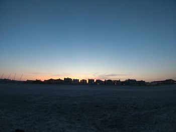 Scenic view of silhouette landscape against clear sky during sunset