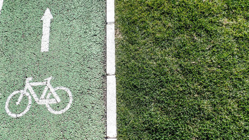 High angle view of bicycle sign on road