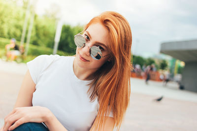 Portrait of beautiful young woman wearing sunglasses