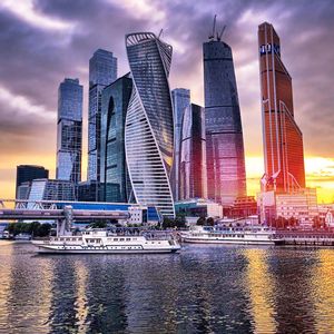 City skyline against cloudy sky