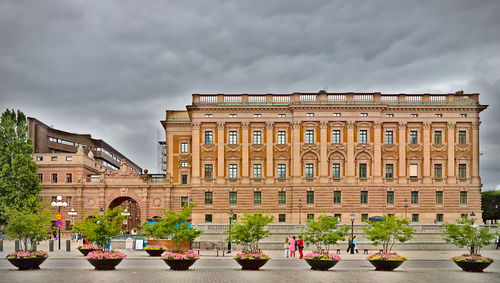 Low angle view of building against cloudy sky