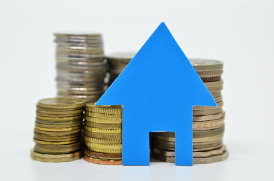 Close-up of coin stack against white background