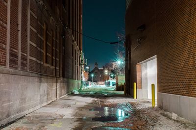 Wet illuminated city at night