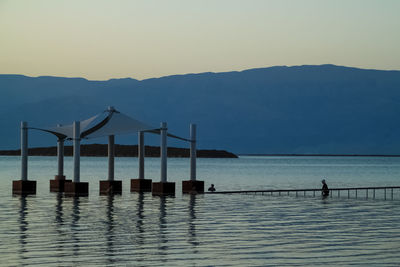 Pier over sea against sky