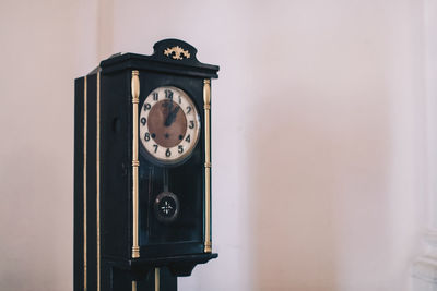 Close-up of clock on wall