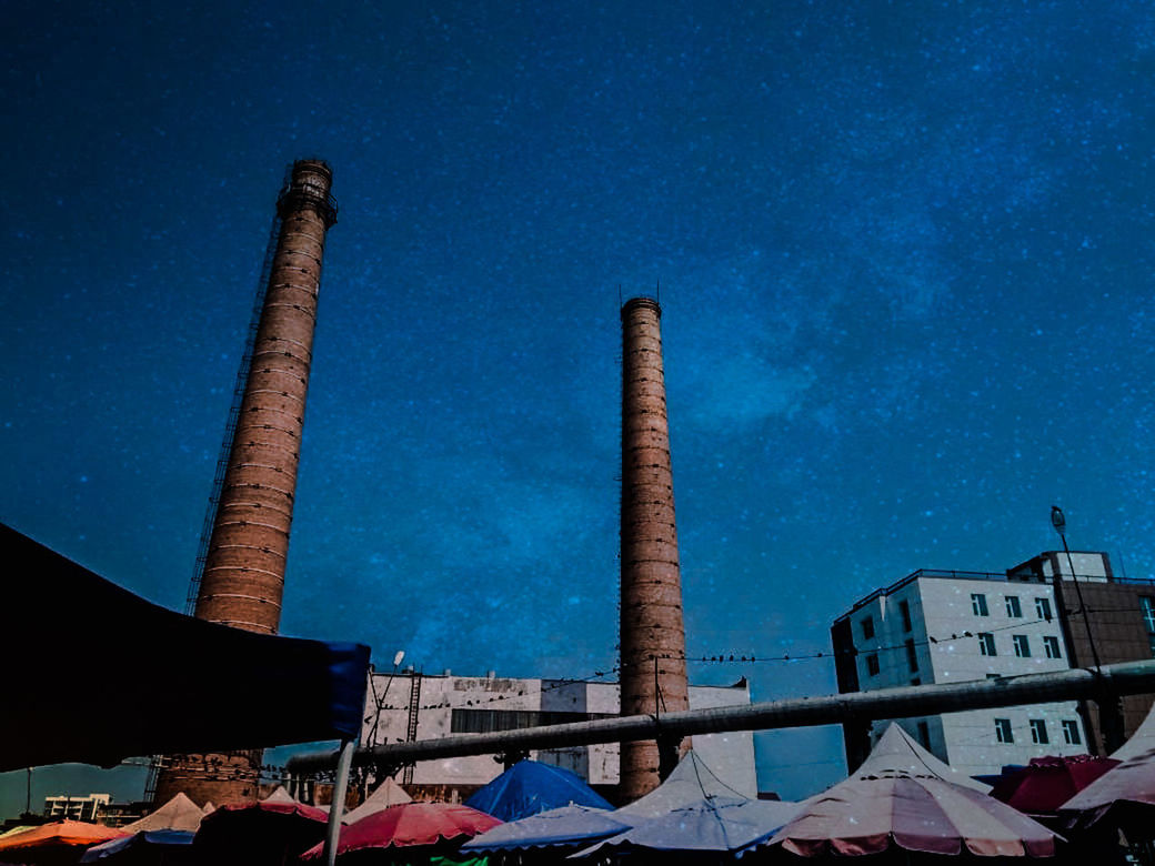 LOW ANGLE VIEW OF INDUSTRY AGAINST BLUE SKY