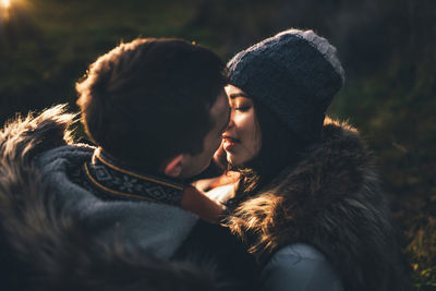 Young couple kissing during winter