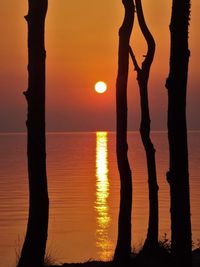 Scenic view of sea against orange sky