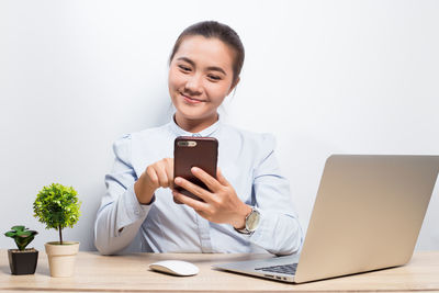 Young woman using mobile phone
