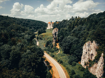 Panoramic view of trees and buildings against sky