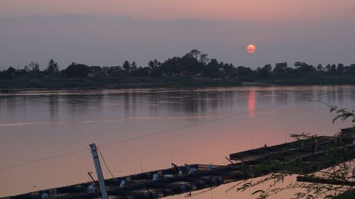 Scenic view of lake at sunset