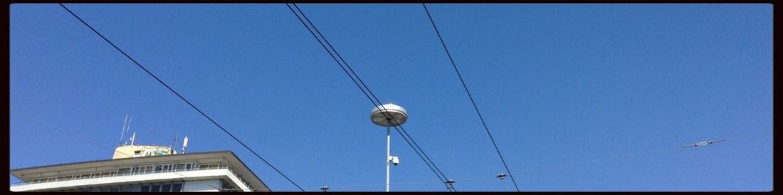 Low angle view of built structure against blue sky