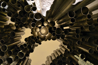 Low angle view of pipes on ceiling of building