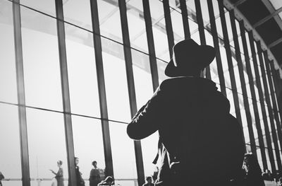 Rear view of silhouette man against sky